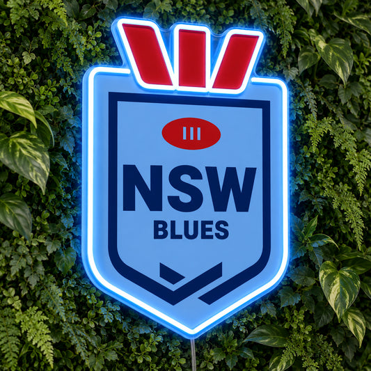 NSW Blues (Shield) LED Neon Sign, featuring illuminated team logo on a green foliage wall.