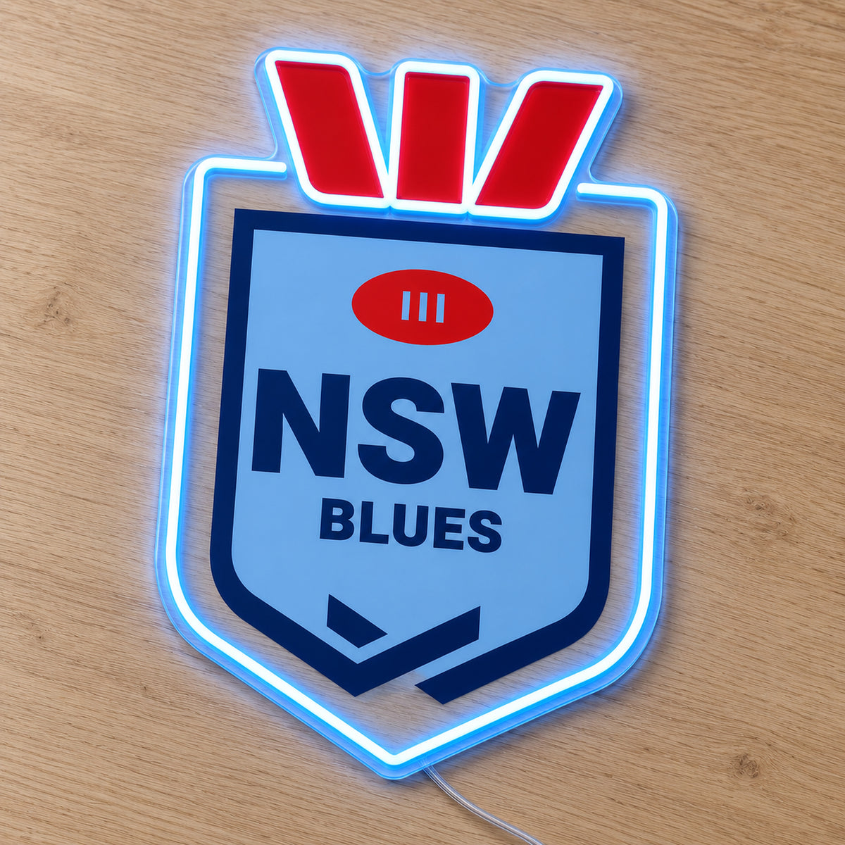 NSW Blues (Shield) LED Neon Sign, featuring illuminated team logo on a wooden surface.