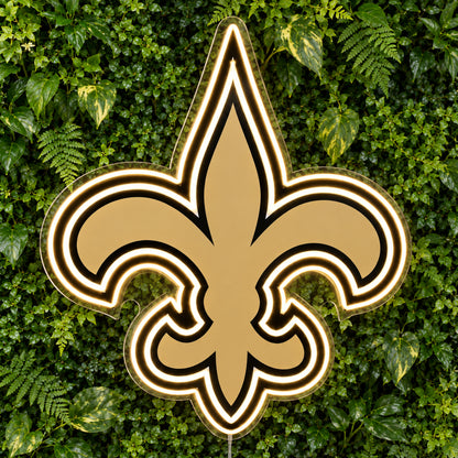 New Orleans Saints LED Neon Sign, featuring illuminated team logo on a green foliage wall.