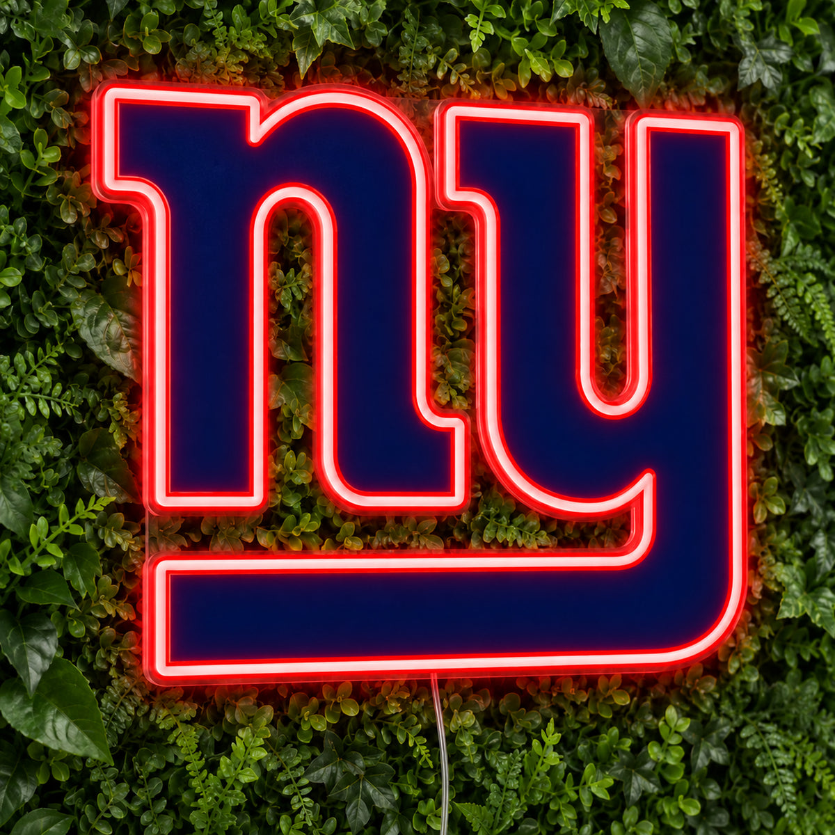 New York Giants LED Neon Sign, featuring illuminated team logo on a green foliage wall.