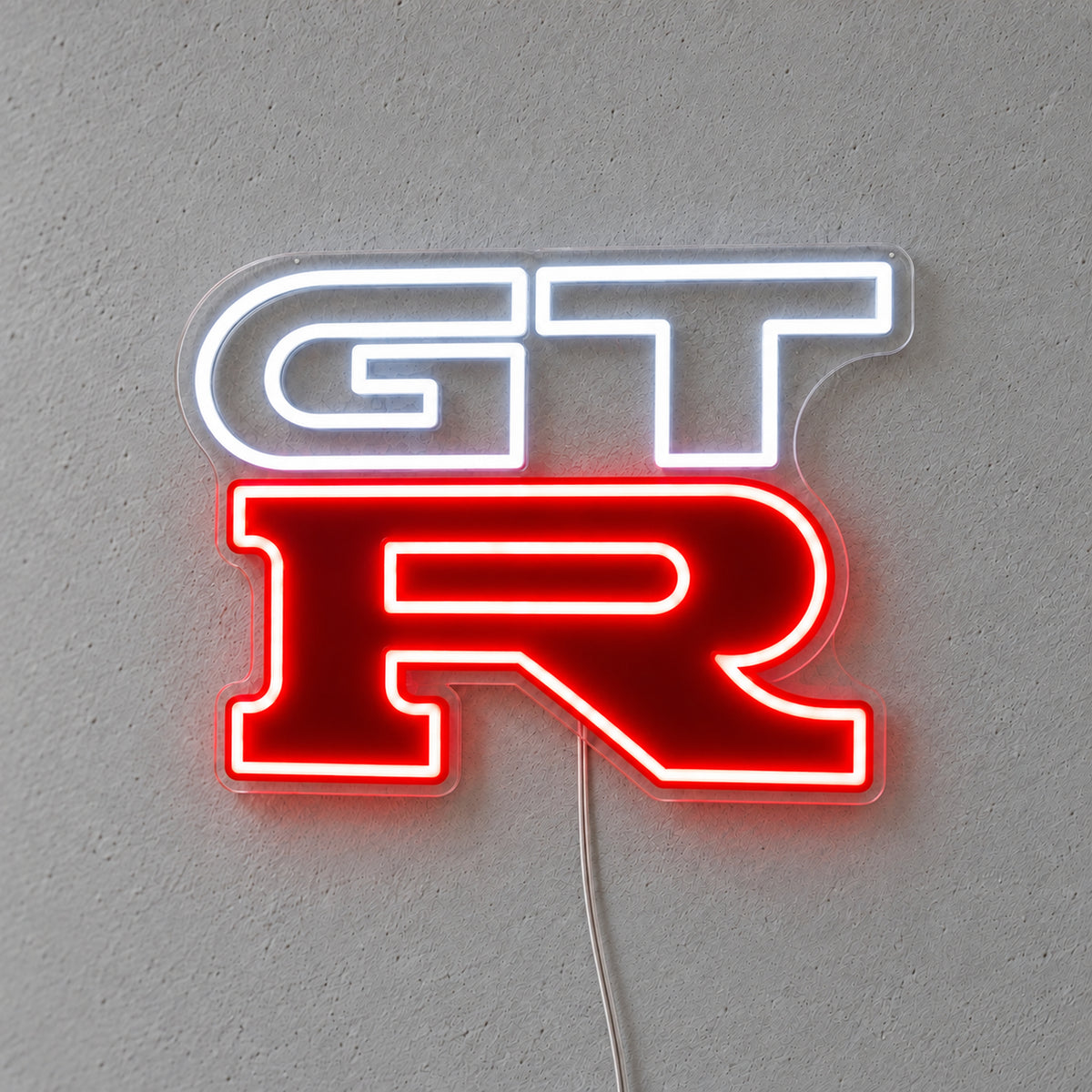Nissan GTR LED Neon Sign in white and red, featuring GT-R logo on a grey wall.