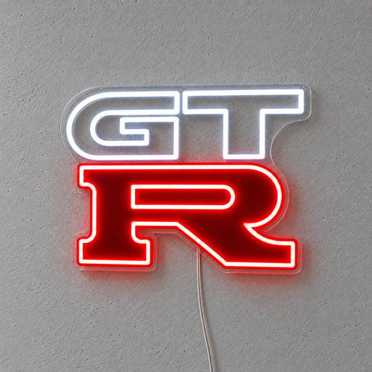 Nissan GTR LED Neon Sign in white and red, featuring GT-R logo on a grey wall.