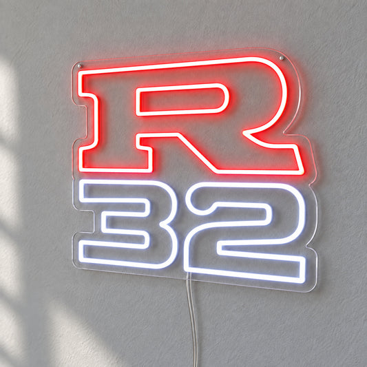 Nissan R32 LED Neon Sign in red and white, featuring R32 lettering on a grey wall.