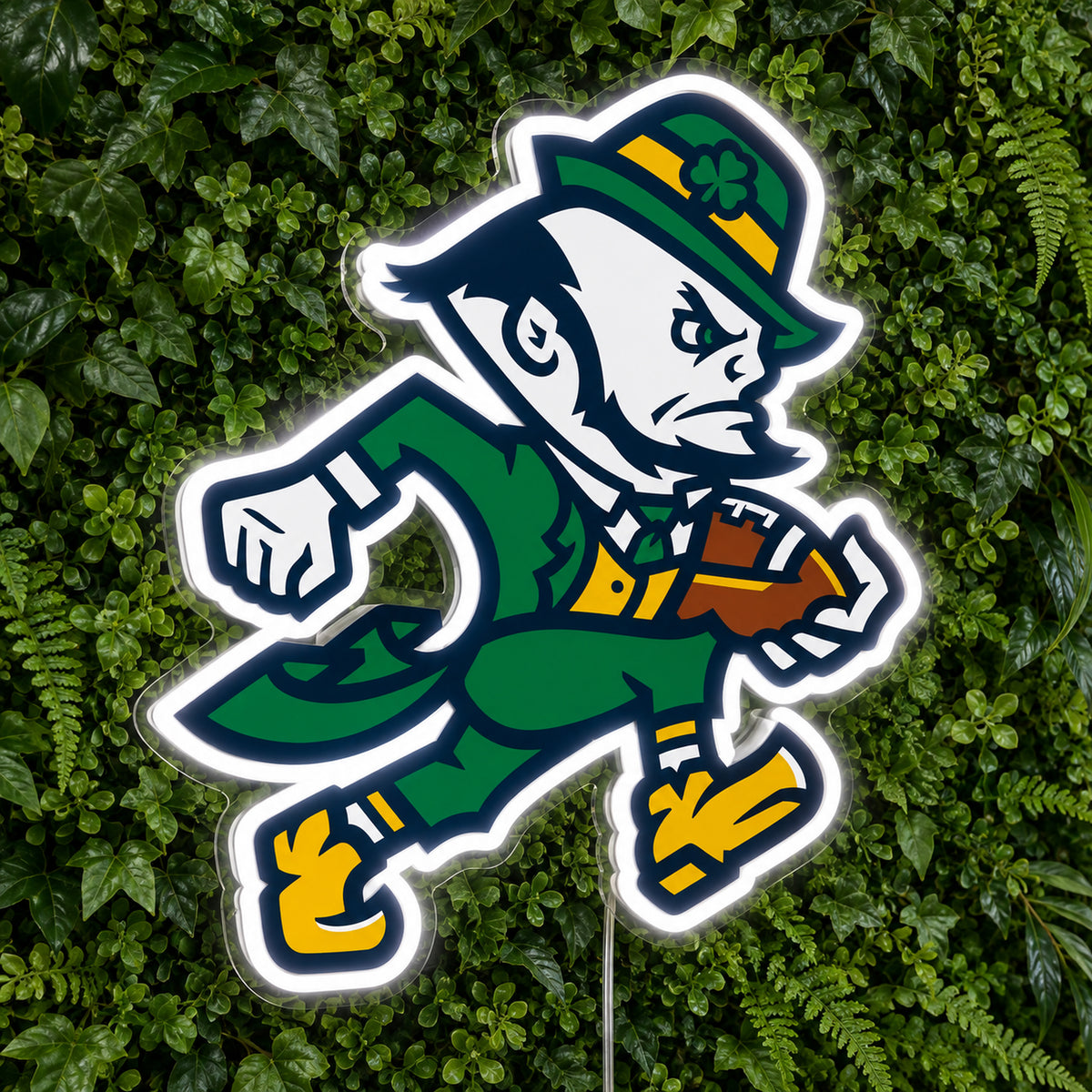 Notre Dame LED Neon Sign, featuring team logo displayed on a green foliage wall.