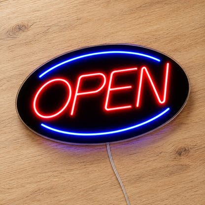 Open Neon Sign - Classic LED Business Sign in red and blue, featuring Open lettering inside an oval border on a wooden surface.