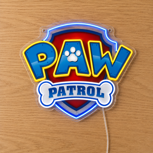 Paw Patrol LED Neon Sign in blue and yellow, featuring the Paw Patrol badge on a wooden surface.