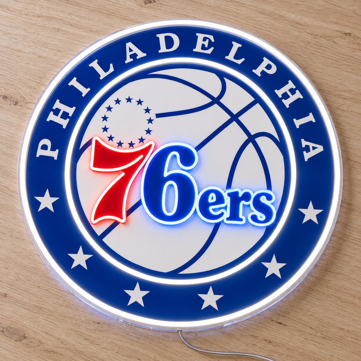 Philadelphia 76ers LED Neon Sign, featuring illuminated team logo on a wooden surface.
