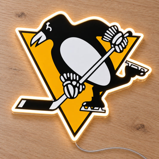 Pittsburgh Penguins LED Neon Sign, featuring team logo displayed on a wooden surface.