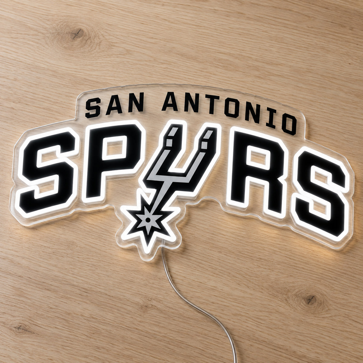 San Antonio Spurs LED Neon Sign, featuring illuminated team logo on a wooden surface.