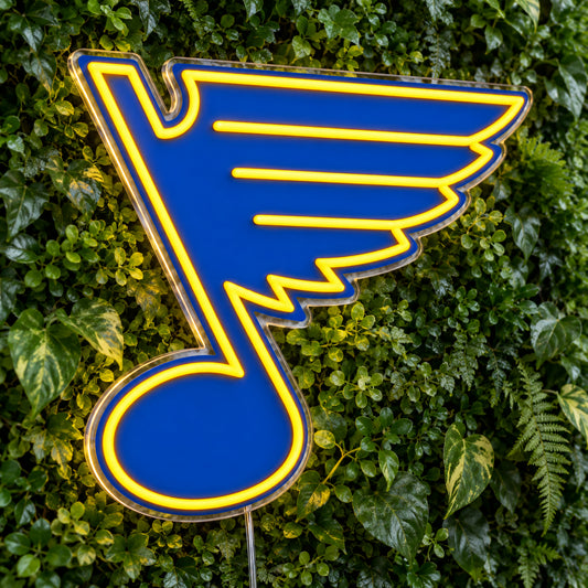St Louis Blues LED Neon Sign, featuring team logo displayed on a green foliage wall.