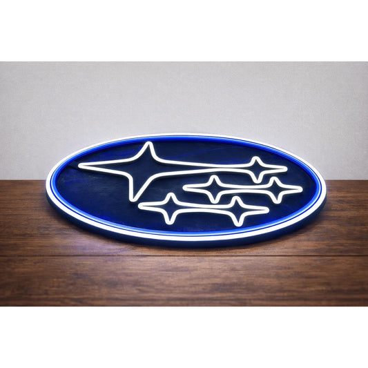 Subaru Logo LED Neon Sign in blue and white, featuring oval Subaru star logo on a wooden surface.