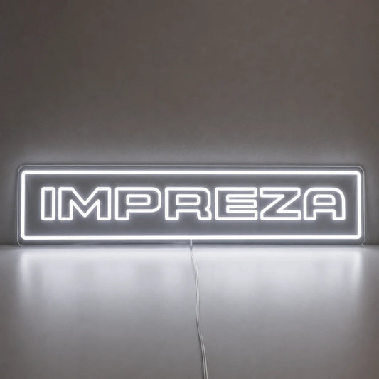 Subaru Impreza WRX Neon Sign in white, featuring Impreza lettering inside a rectangular border on a reflective surface.