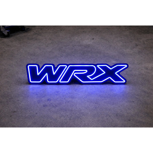 Subaru WRX LED Neon Sign in blue, featuring WRX lettering on a dark surface.