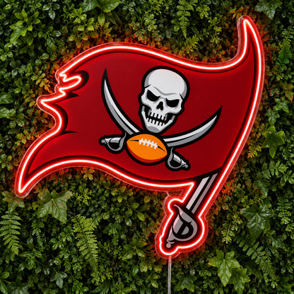 Tampa Bay Buccaneers LED Neon Sign, featuring illuminated team logo on a green foliage wall.