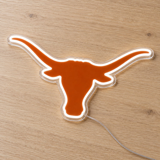 Texas Longhorns LED Neon Sign, featuring illuminated team logo on a wooden surface.