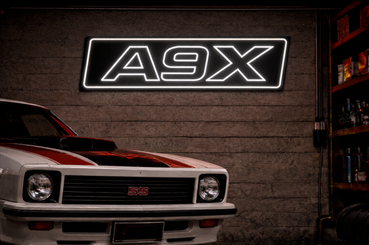 Torana A9X LED Neon Light Sign on a garage wall with a Holden A9X Torana Car