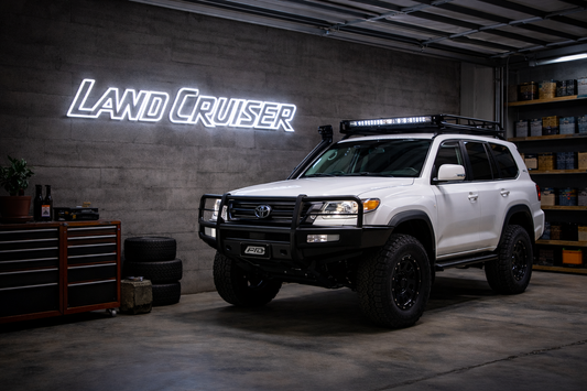 Toyota Land Cruiser LED neon sign mounted in a garage, bold 4WD wall light for off road setups
