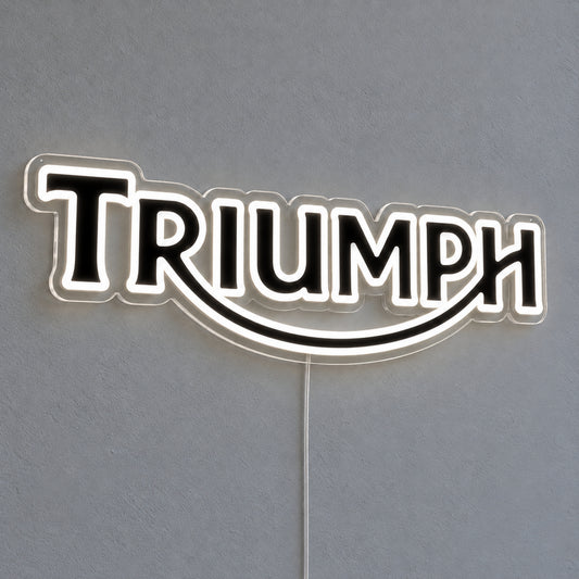 Triumph LED Neon Sign, featuring illuminated vehicle logo on a light background.