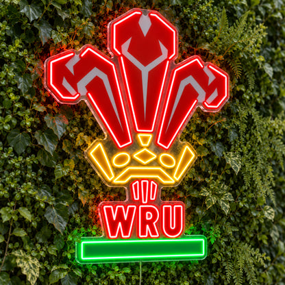 Wales Rugby LED Neon Sign, featuring team logo displayed on a green foliage wall.