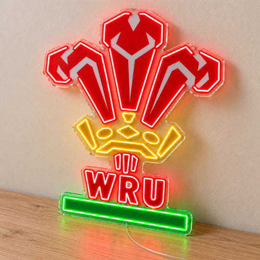 Wales Rugby LED Neon Sign, featuring team logo displayed on a wooden surface.