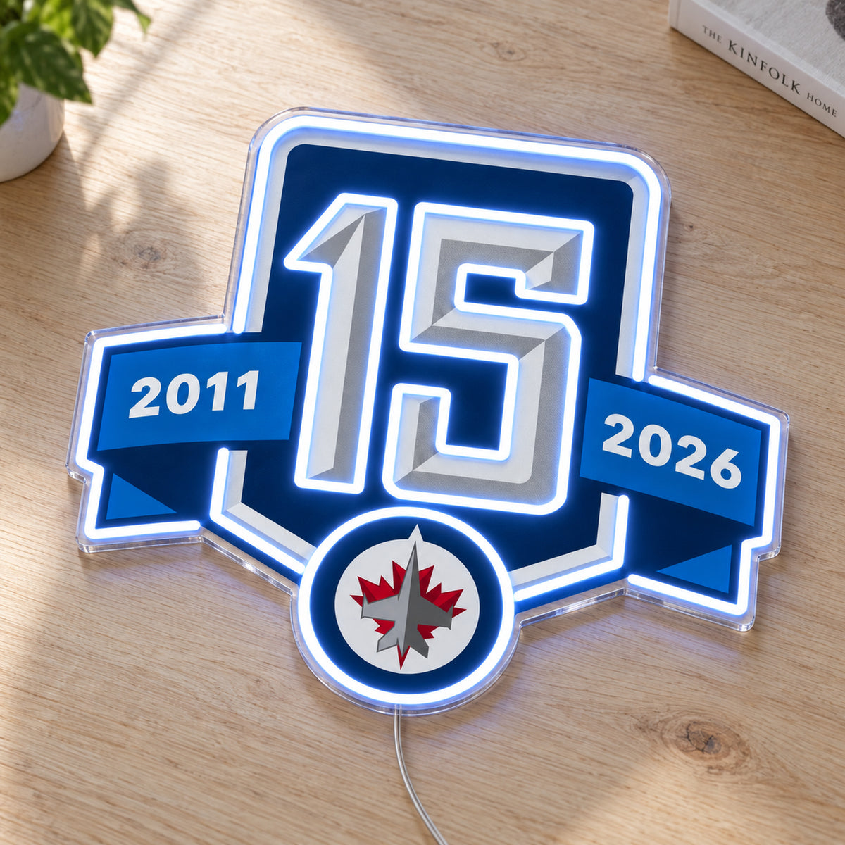 Winnipeg Jets 15th Anniversary LED Neon Sign, featuring team logo displayed on a wooden surface.
