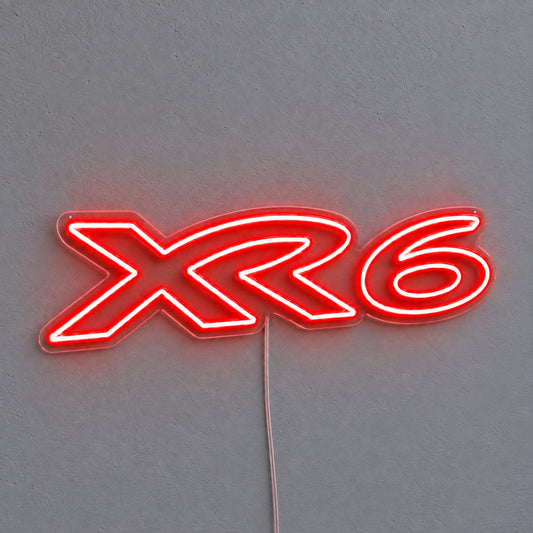 XR6 Ford Falcon LED Neon Sign in red, featuring XR6 lettering on a grey wall.