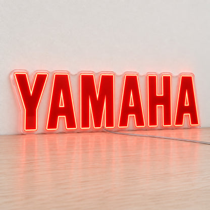 Yamaha (Red) LED Neon Sign in red, featuring Yamaha lettering on a light reflective surface.