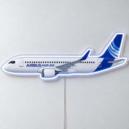 Airbus A220 Neon Sign with printed aircraft details and an illuminated LED outline on clear acrylic, shown from the front on a white surface