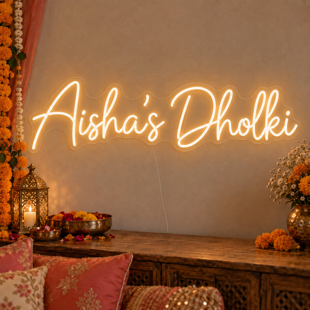 Personalised Dholki Neon Sign on clear cut-to-shape acrylic, illuminated on a wall in a styled celebration setting; sample personalised wording shown