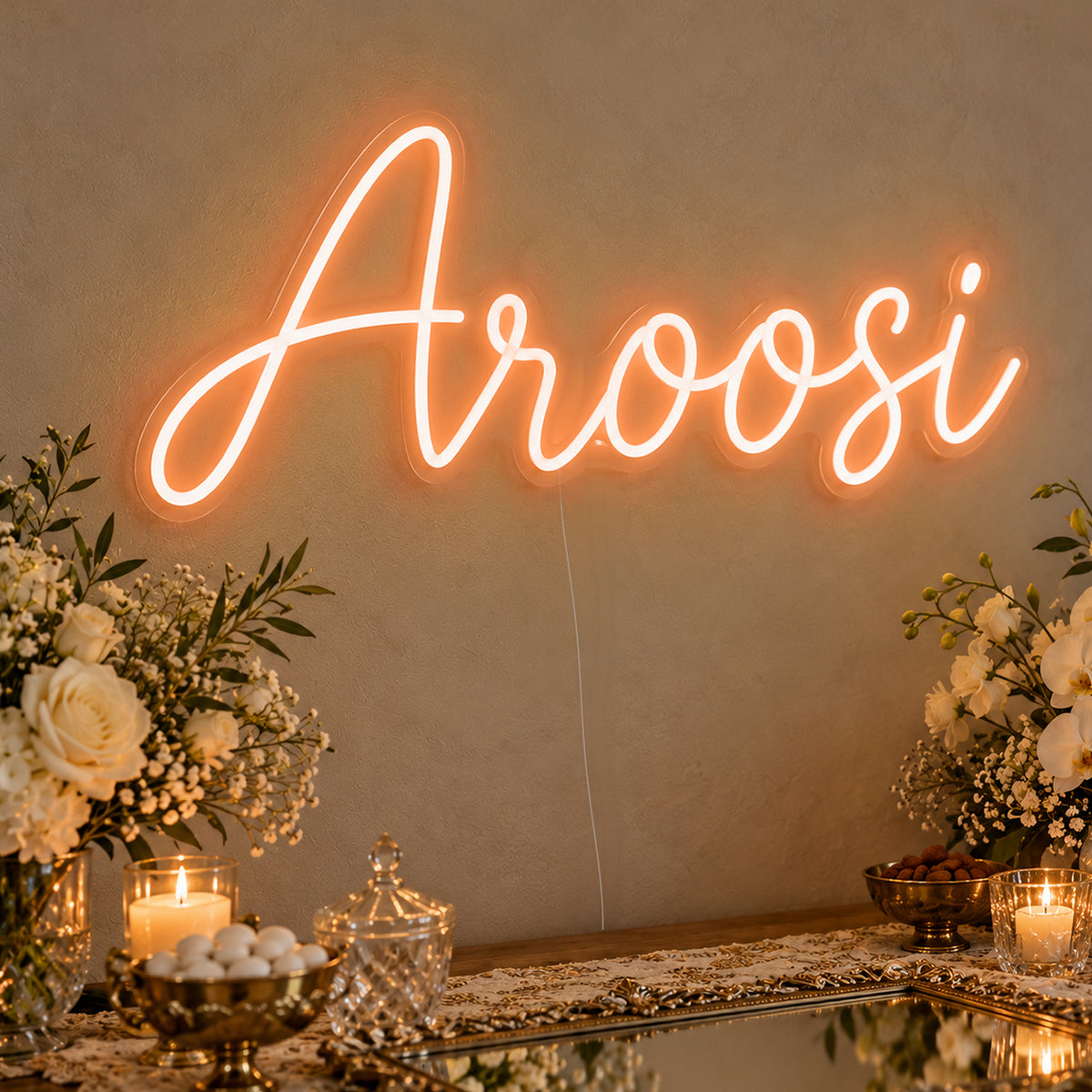 Aroosi Neon Sign in orange LED neon on clear acrylic, angled view