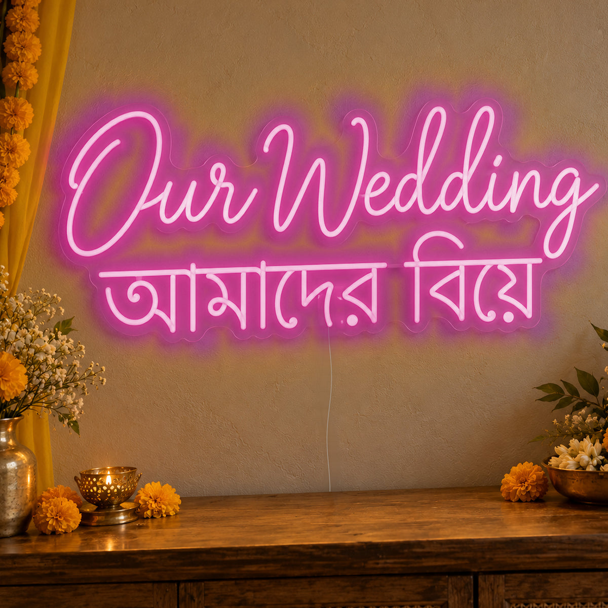 Our Wedding English & Bengali Neon Sign in pink LED neon on clear acrylic, angled view