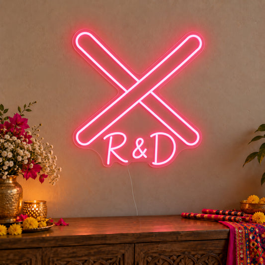 Personalised Dandiya Initials Neon Sign on clear cut-to-shape acrylic in an illuminated wall display; example personalisation shown.