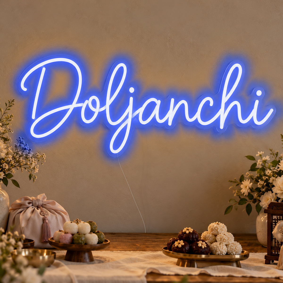 Doljanchi Neon Sign in blue LED neon on clear acrylic, angled view
