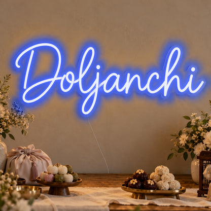 Doljanchi Neon Sign in blue LED neon on clear acrylic, angled view