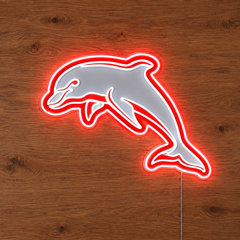 Dolphins Neon Sign, featuring illuminated team logo on a wooden surface.