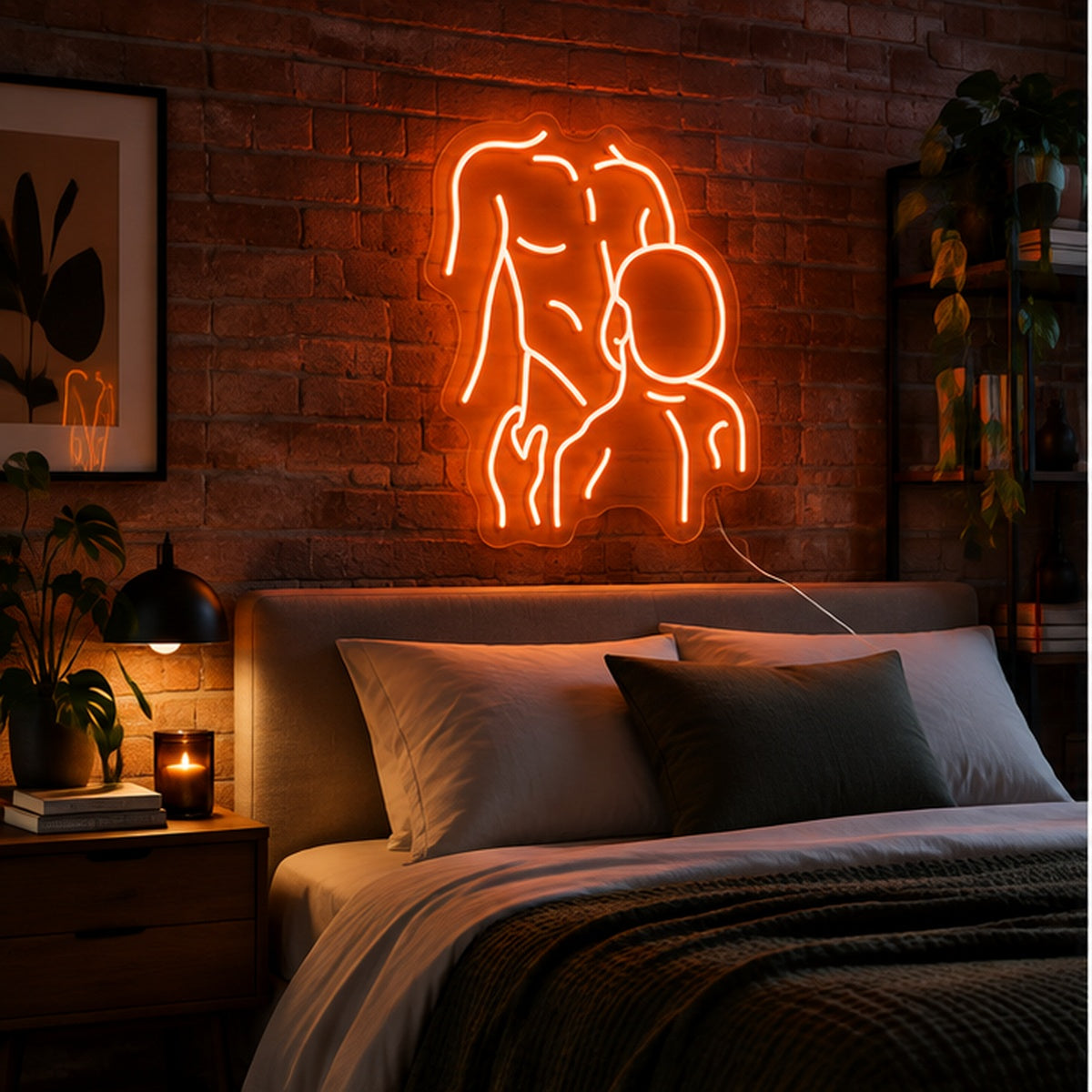 Gay Pride Two Men Neon Sign in orange, featuring an outline of two men kissing on a brick bedroom wall above a bed.