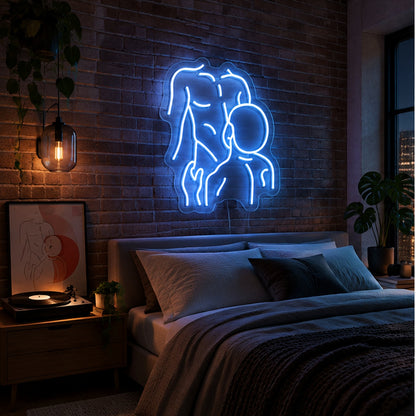 Gay Pride Two Men Neon Sign in light blue, featuring an outline of two men kissing on a brick bedroom wall above a bed.