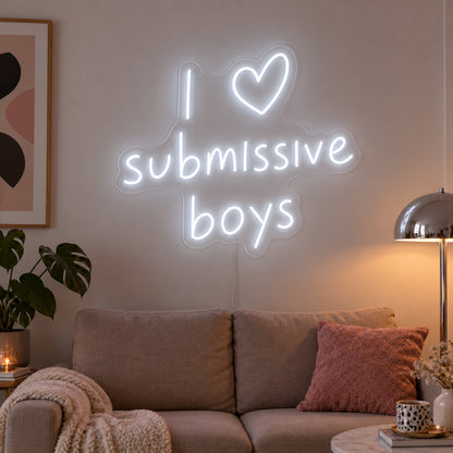 I Love Submissive Boys Neon Sign glowing white above a neutral sofa.