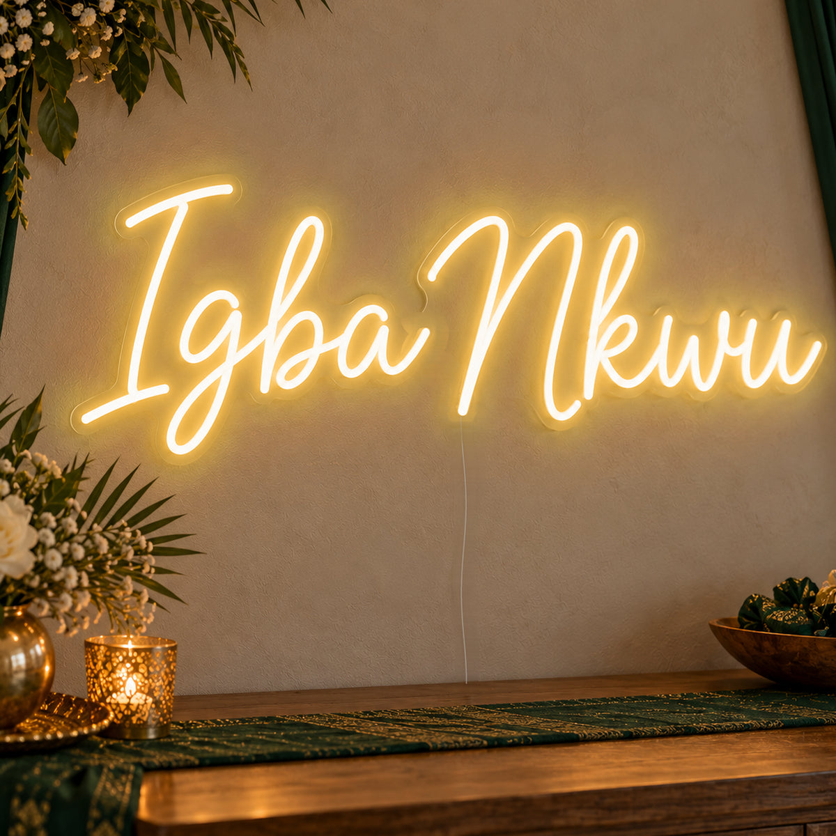 Igba Nkwu Neon Sign in gold LED neon on clear acrylic, angled view