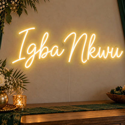 Igba Nkwu Neon Sign in gold LED neon on clear acrylic, angled view