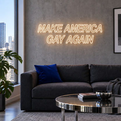Warm White version of the Make America Gay Again Neon Sign, shown above a charcoal sofa.