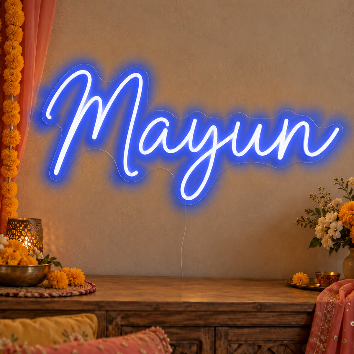 Mayun Neon Sign in blue LED neon on clear acrylic, angled view