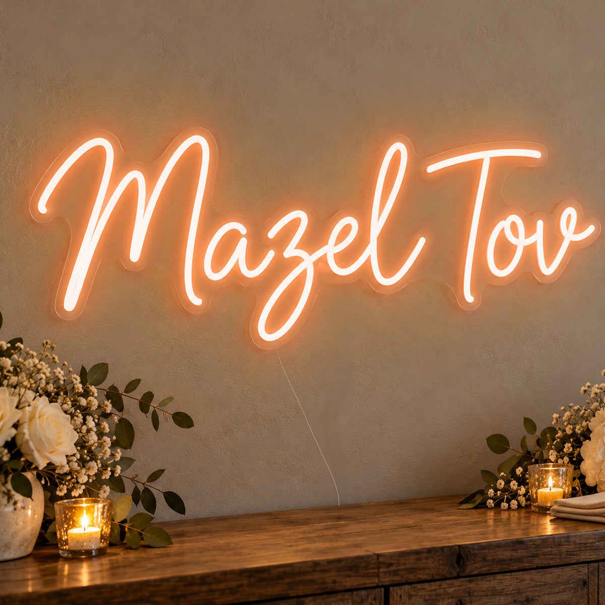 Mazel Tov Neon Sign in orange LED neon on clear acrylic, angled view