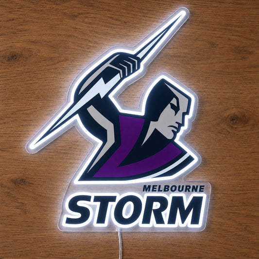 Melbourne Storm Neon Sign, featuring illuminated team logo on a wooden surface.