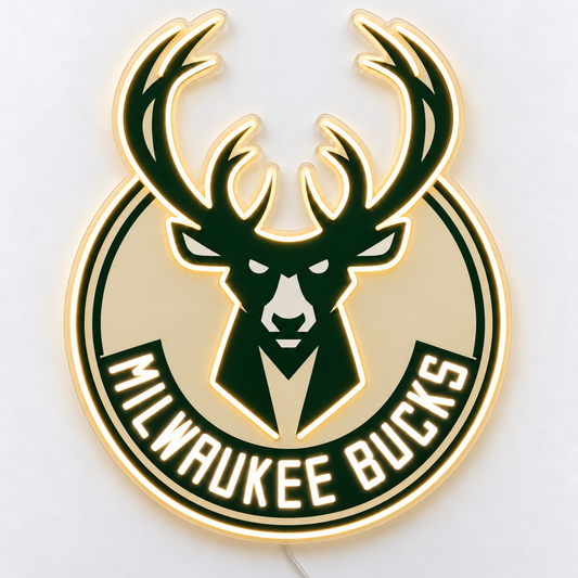 Milwaukee Bucks neon sign on a white surface, with warm white antler and deer head outlines, green and cream artwork and a thin wire emerging from behind.