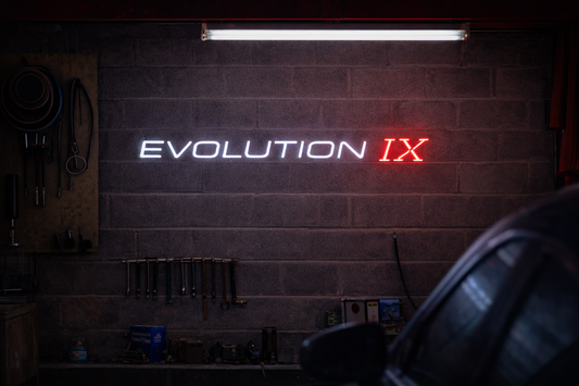 Mitsubishi Lancer Evolution IX inspired LED neon sign in red and white on brick wall, premium car neon sign Australia by Neon Lanes.