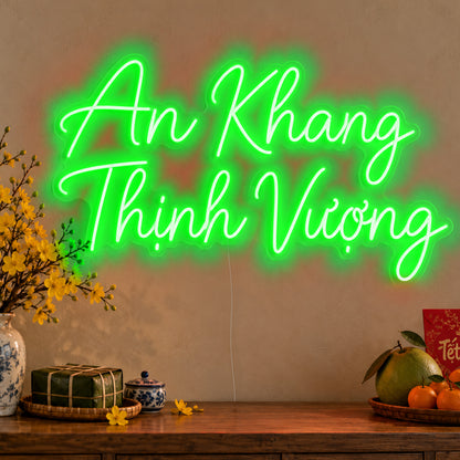 An Khang Thịnh Vượng Neon Sign in green LED neon on clear acrylic, angled view