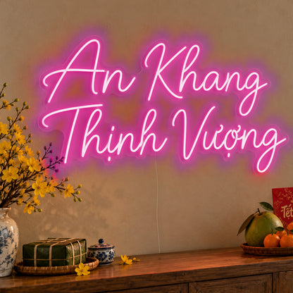 An Khang Thịnh Vượng Neon Sign in pink LED neon on clear acrylic, angled view