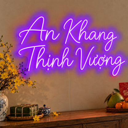 An Khang Thịnh Vượng Neon Sign in purple LED neon on clear acrylic, angled view