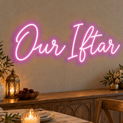 Our Iftar Neon Sign in pink LED neon on clear acrylic, angled view